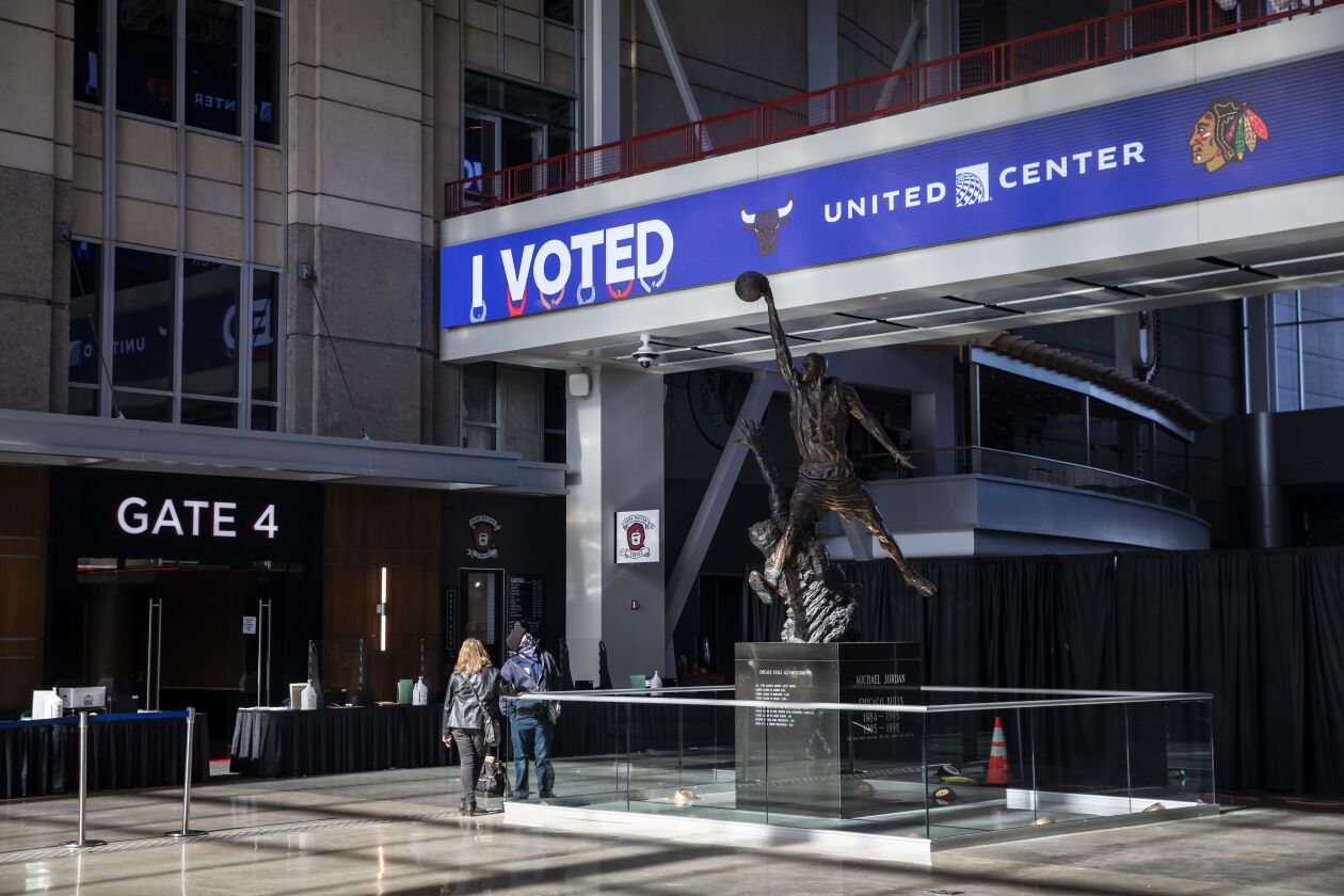 Election workers prepare the United Center at 1901 W. Madison St. as an Election Day voting super site, Monday morning.
